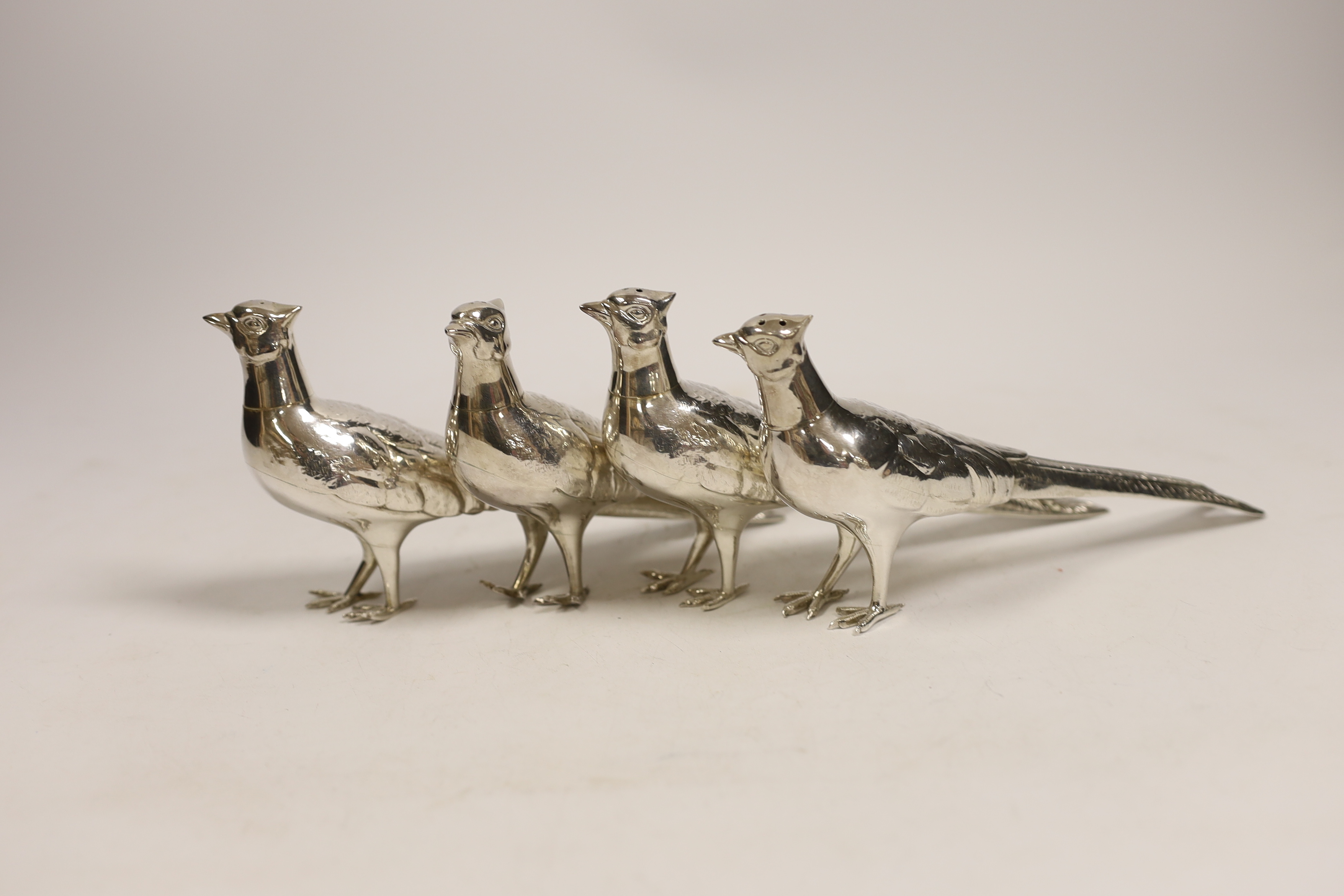 A set of four Japanese sterling condiments, by Kichigoro Uyeda, modelled as game birds, height 93mm, 16oz.